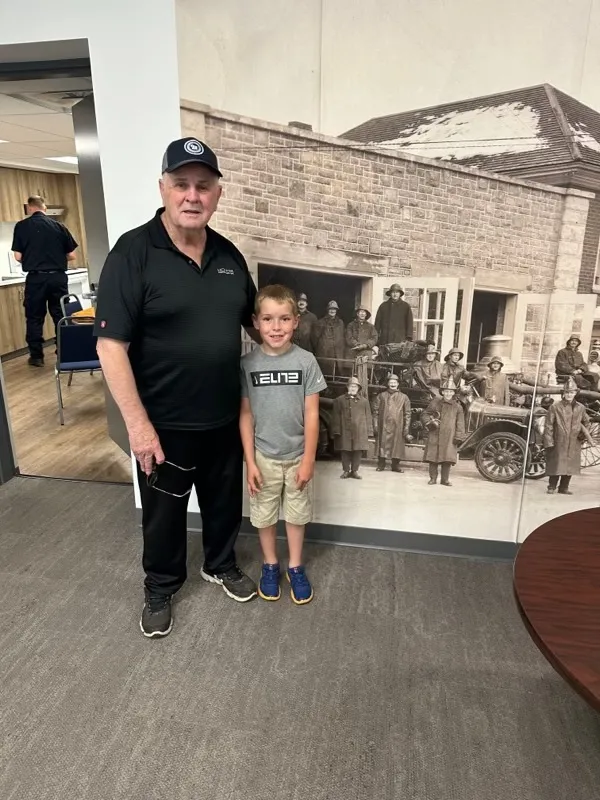 Claude Matte and grandson Luke at Smiths Falls fire station.